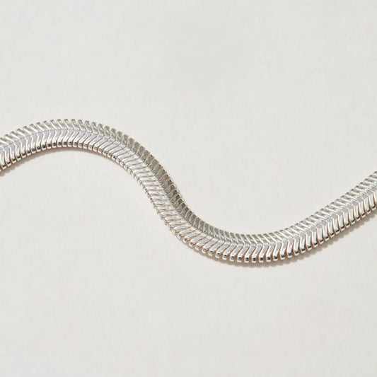 Flat silver herringbone chain, detailed shot showcasing its bold 4.2mm width.