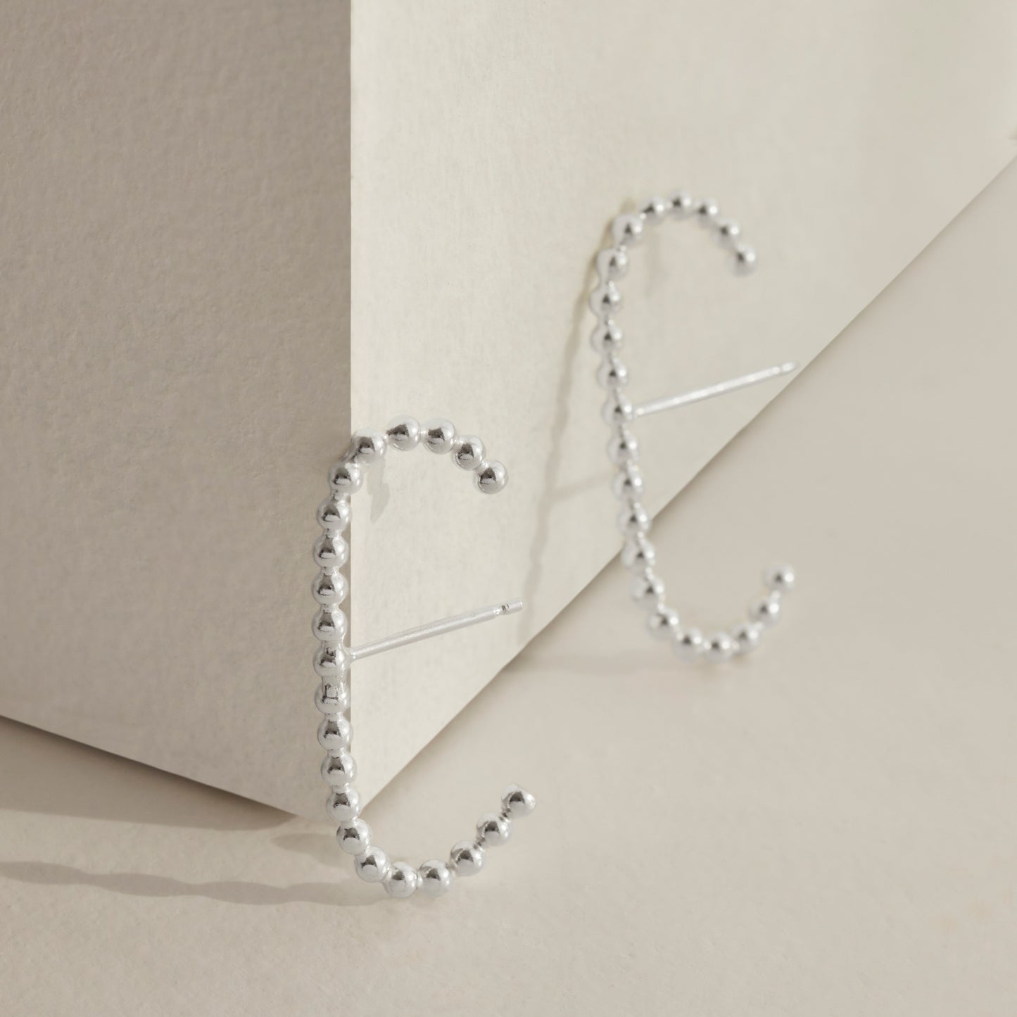 A pair of our sterling silver beaded cuff earrings.