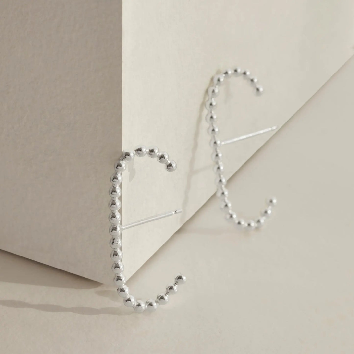 A pair of our sterling silver beaded cuff earrings.