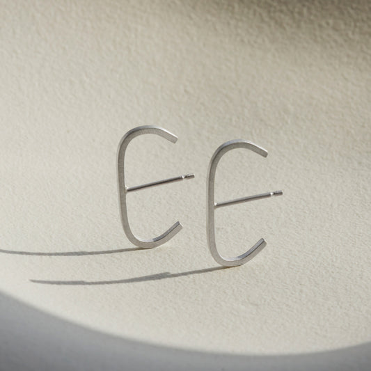 A pair of our sterling silver slim cuff earrings.