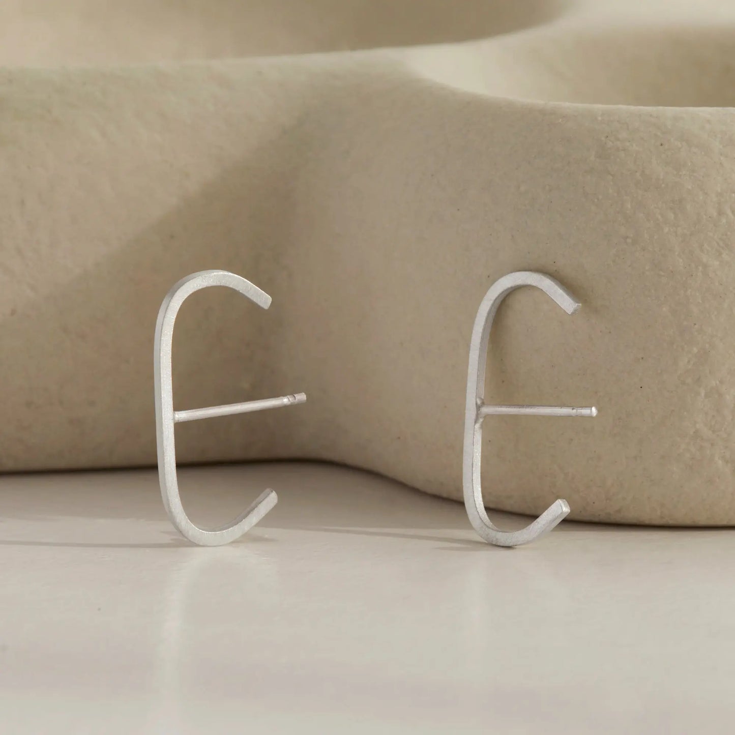 A pair of our sterling silver slim cuff earrings.