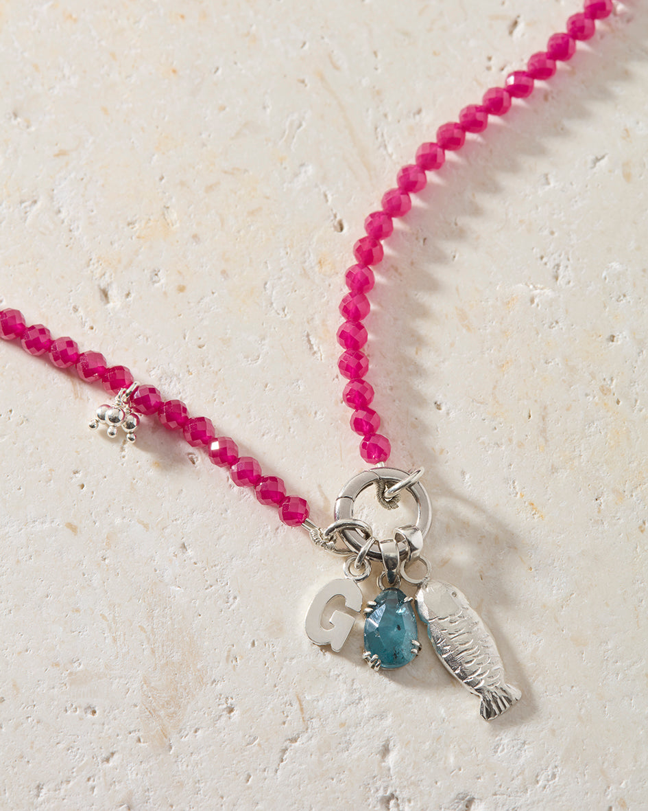 Personalised ruby beaded necklace with sterling silver sardine, initial charm and hand-set kyanite gemstone