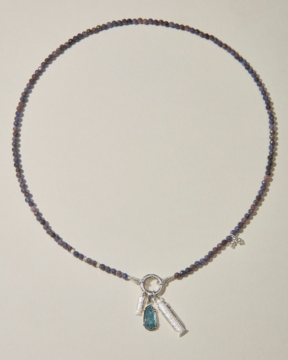 Full sapphire beaded necklace with sterling silver fish charms and blue-green kyanite pendant