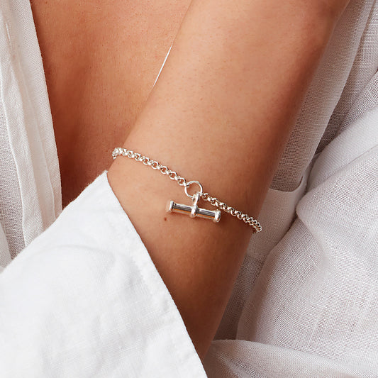 Sterling silver T bar charm bracelet styled on wrist