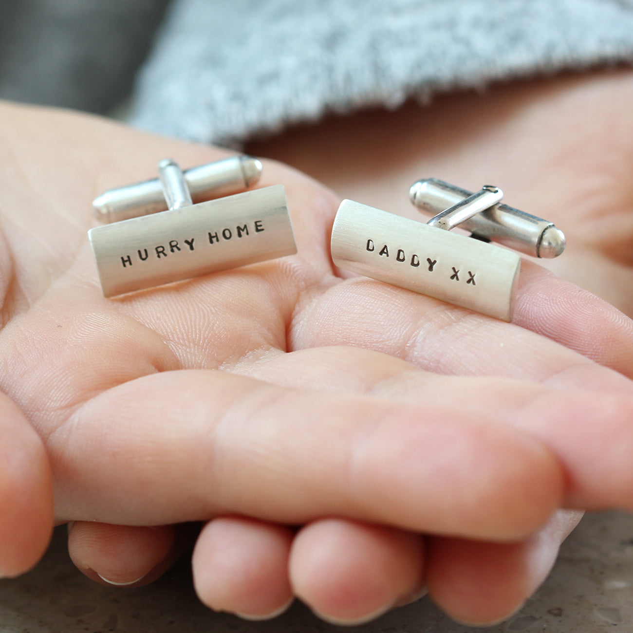 Personalised sterling silver cufflinks showing the elegant bullet-back fastening engraved with 'Hurry Home' and 'Daddy xx'