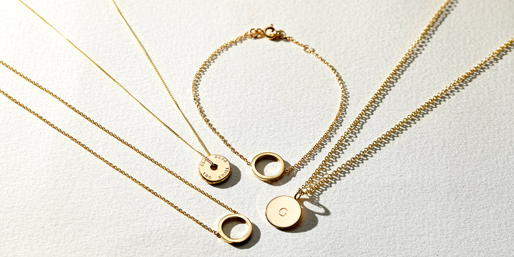 a group shot of beautiful gold necklaces all circular 