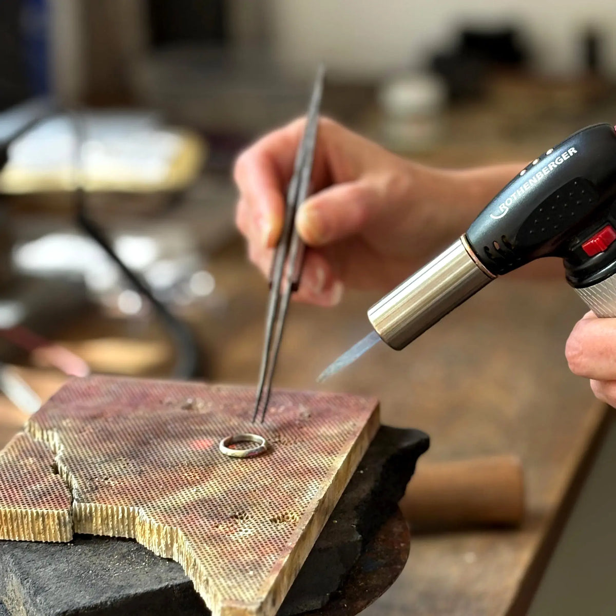 Jewellery making workshop in Leeds with hands shaping silver at Soremi