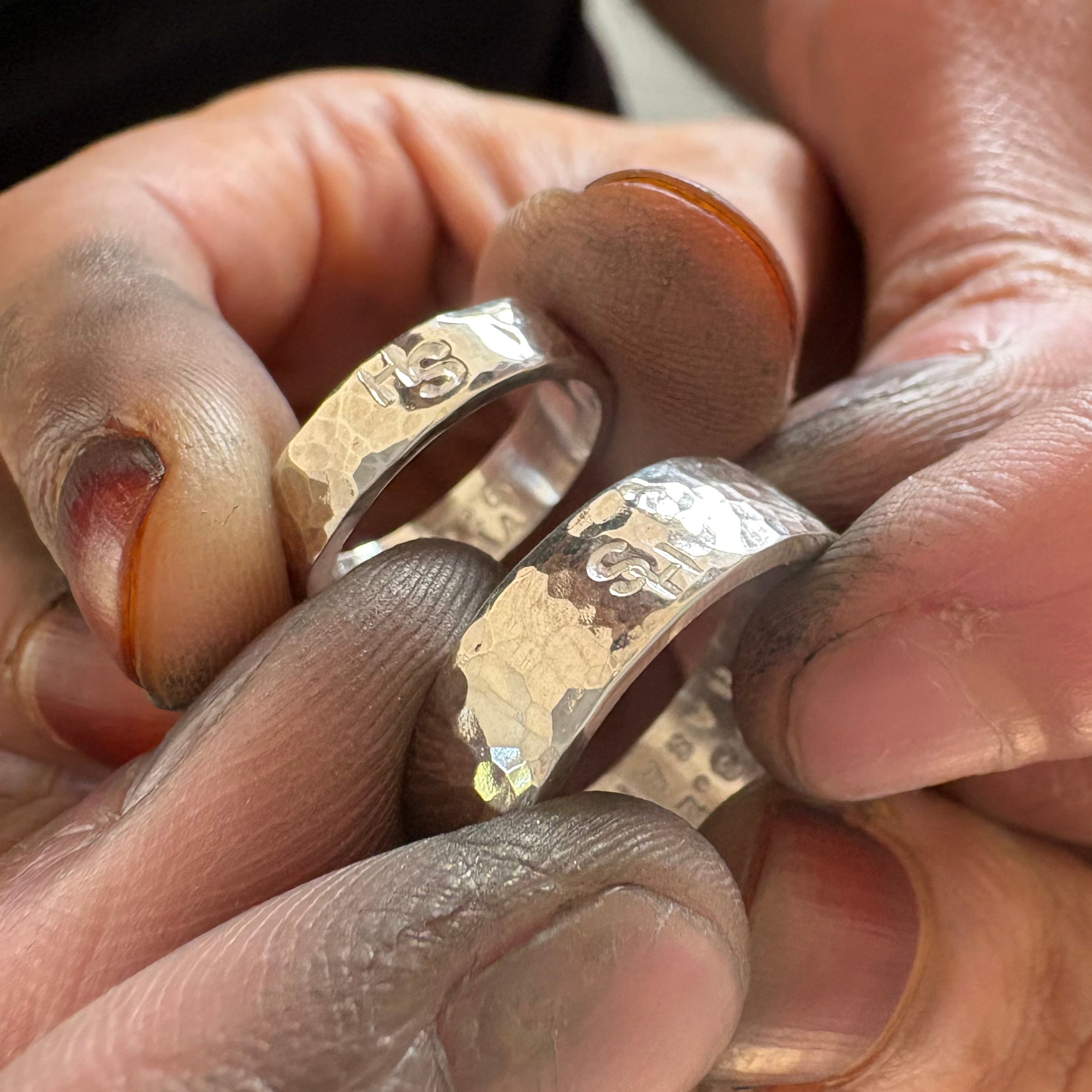 Two silver wedding rings made by hand in our Leeds workshop