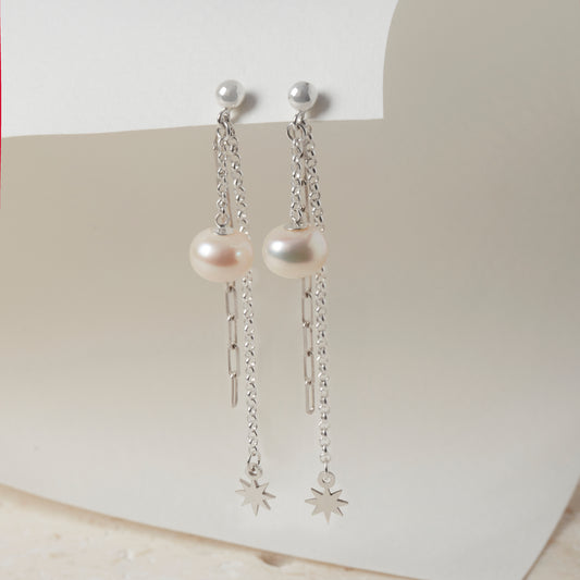 Pearl and sterling silver chain drop earrings with star