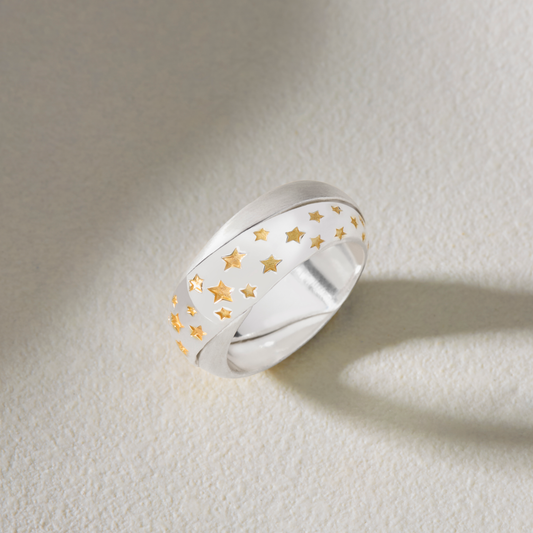 Personalised Möbius ring in sterling silver with polished and matt finishes and gold stars