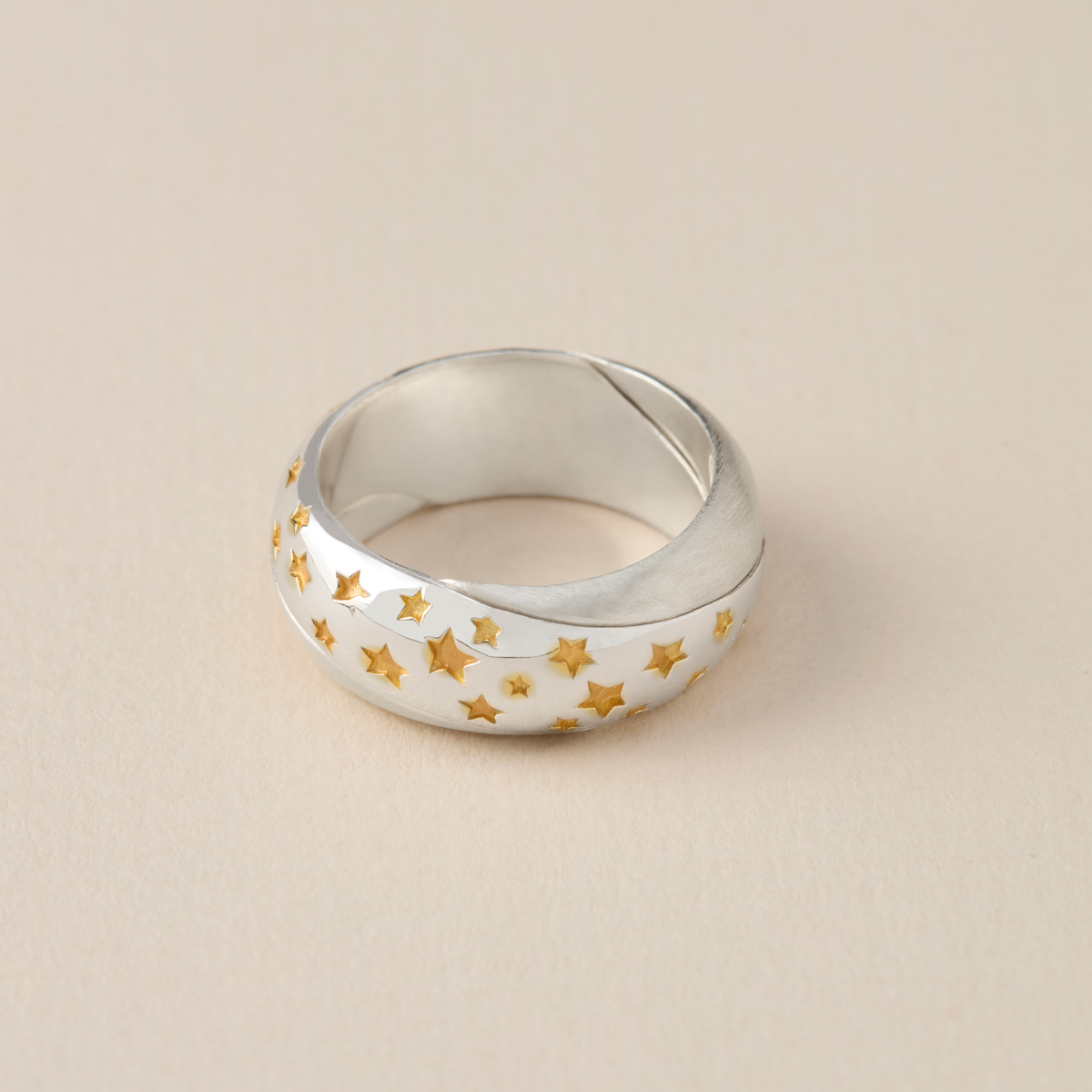 Sterling silver celestial Möbius ring with 18ct gold-plated star details