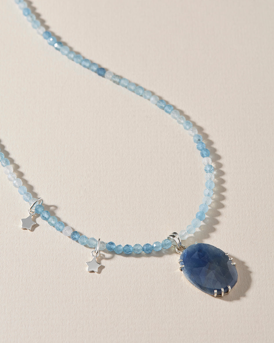 Full aquamarine gemstone necklace with one-of-a-kind blue sapphire pendant and silver stars