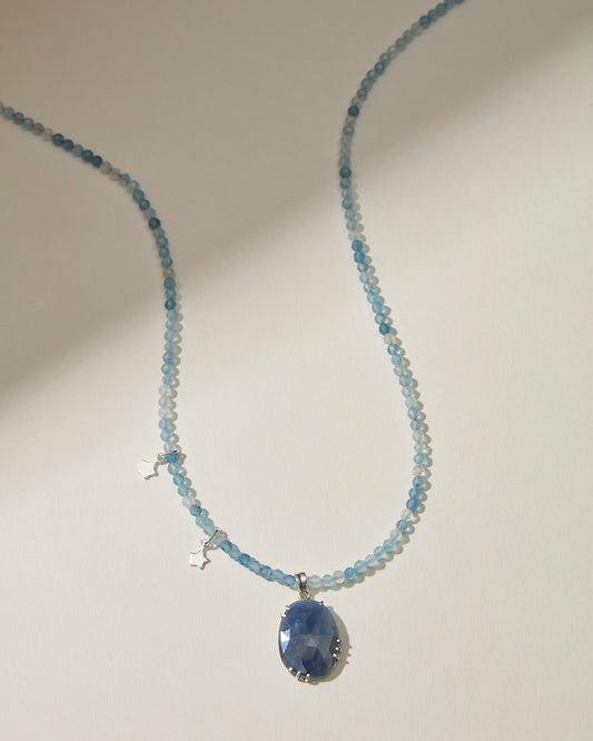 Aquamarine beaded necklace with large blue sapphire pendant and sterling silver star charms