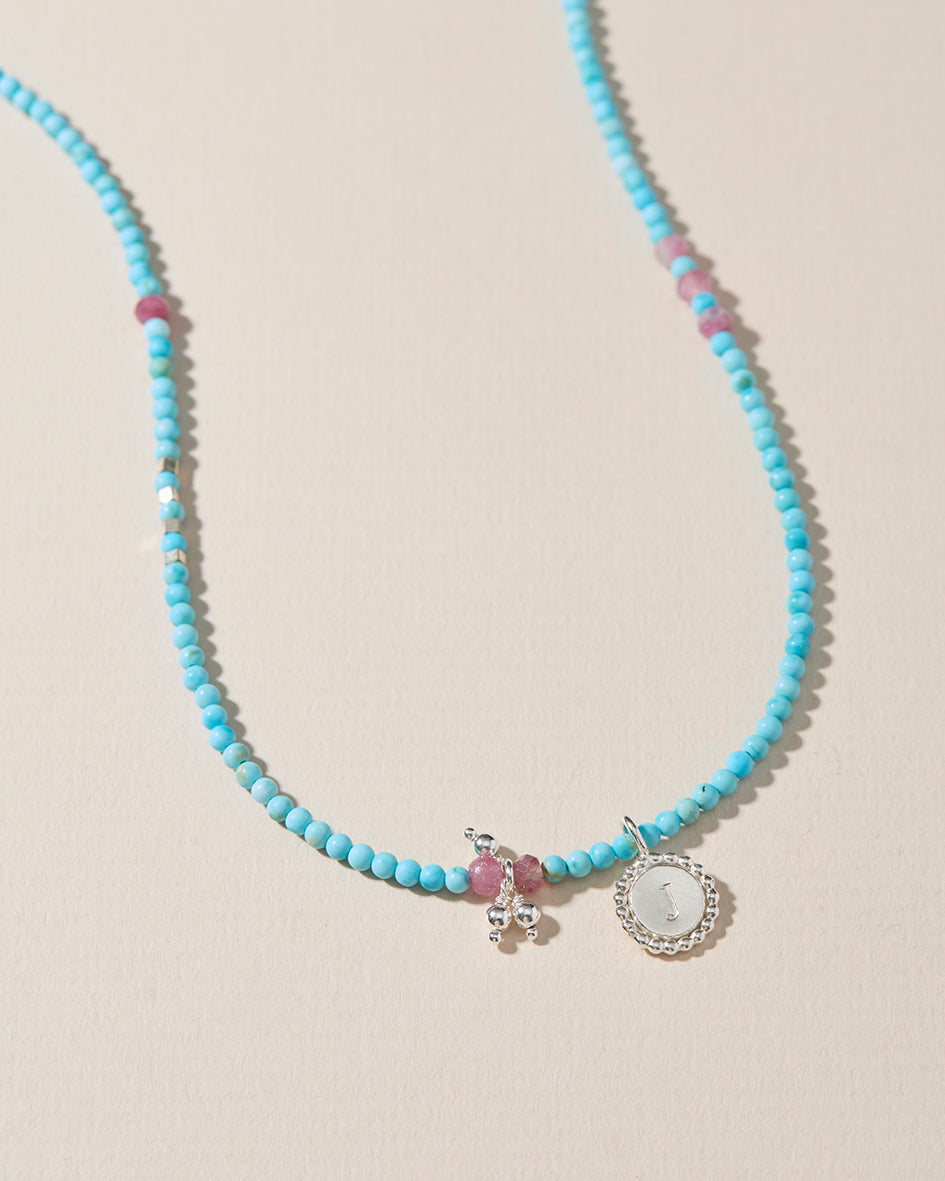 Personalised turquoise beaded initial necklace with pink tourmaline and sterling silver pendant