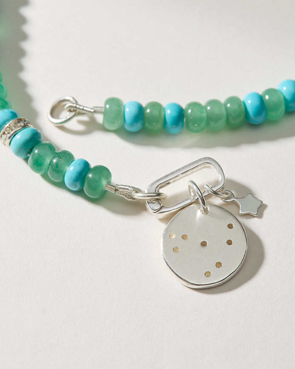 Sterling silver zodiac constellation pendant with hand-drilled stars and turquoise accent beads