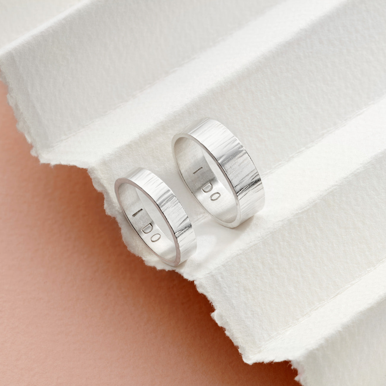 Silver personalised his and hers rings 