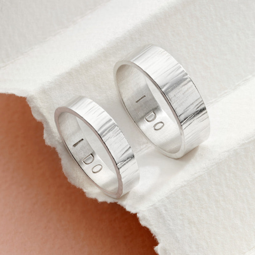 Silver personalised his and hers rings 