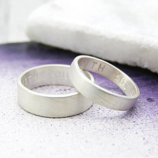 Sterling silver matching rings with subtle hand-stamped personalisation