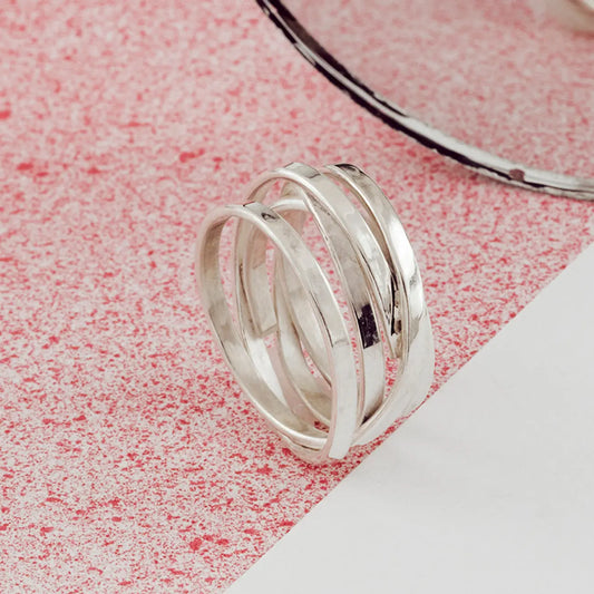 Sterling silver Scroll Ring worn on hand showing wide layered silver design
